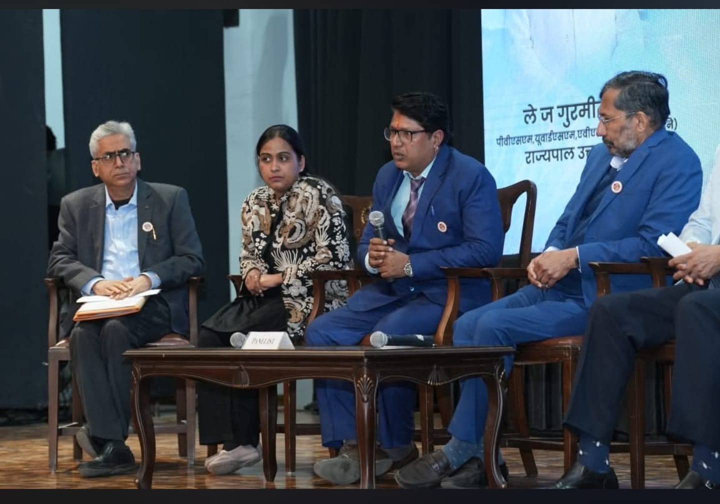 Dr. Nisha Singla seated as a panellist at a state-level mental health discussion